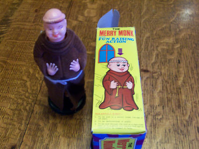 A toy figurine next to a box

Description automatically generated